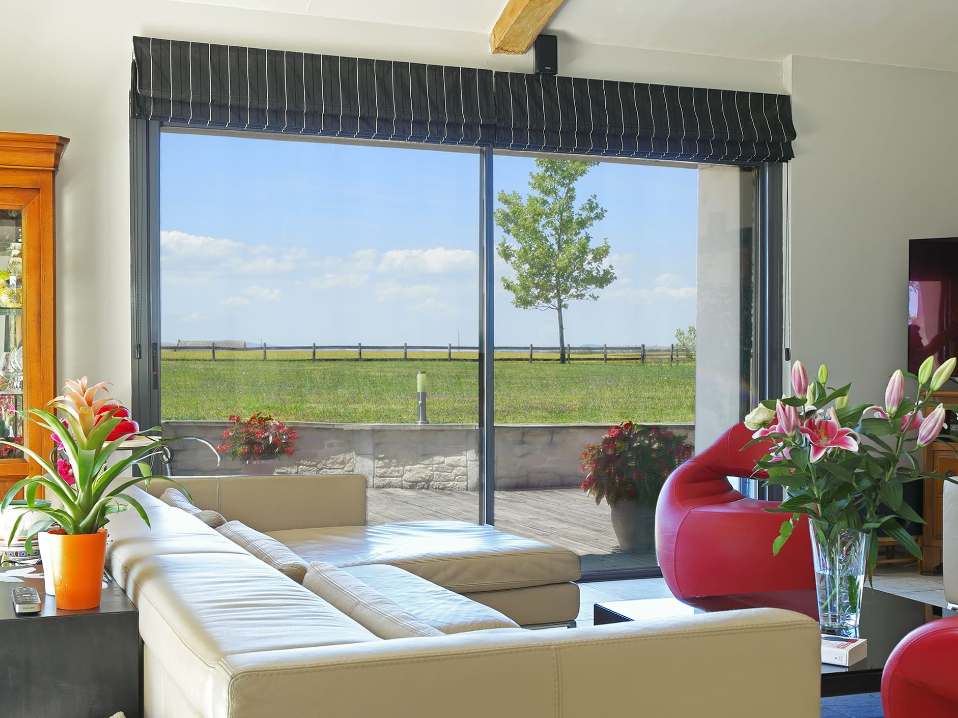 Glazing with ceramic film reduces UV, IR and heat in interior view