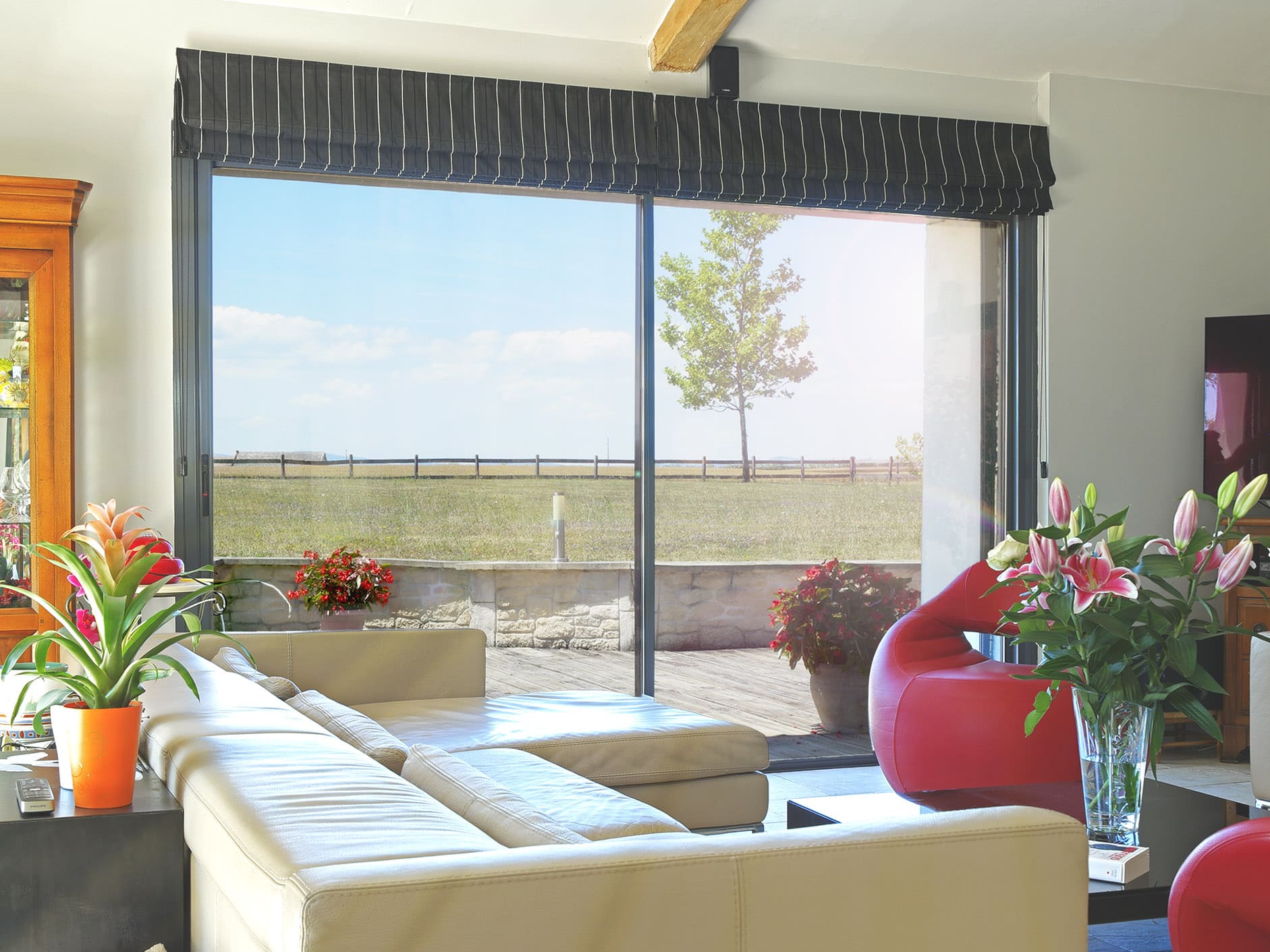 Glazing with ceramic film reduces UV, IR and heat in interior view